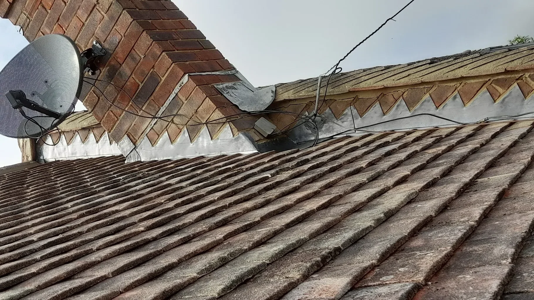 Lead apron and back gutter at the base of a brick chimney, fitted by LDR Roofing