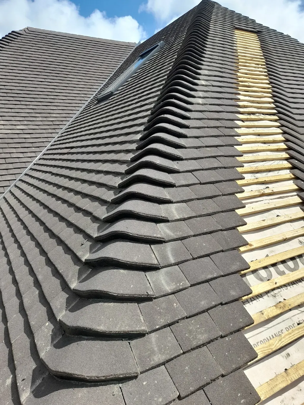Bonnet hip tiles being fitted on a pitched roof by LDR Roofing