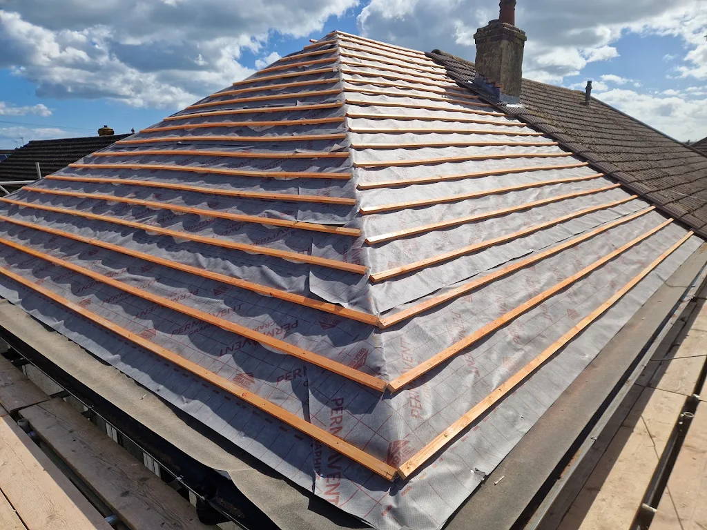 Breathable membrane and new battens on a hipped roof during a full re-roof by LDR Roofing