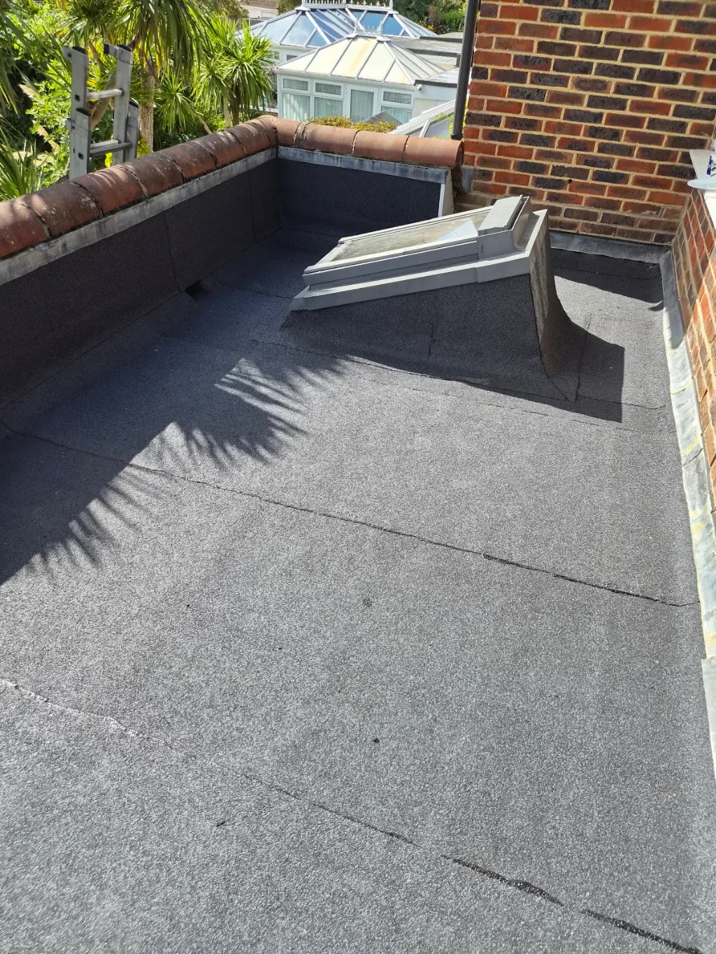 Flat roof and roof light with a finished felt covering by LDR Roofing